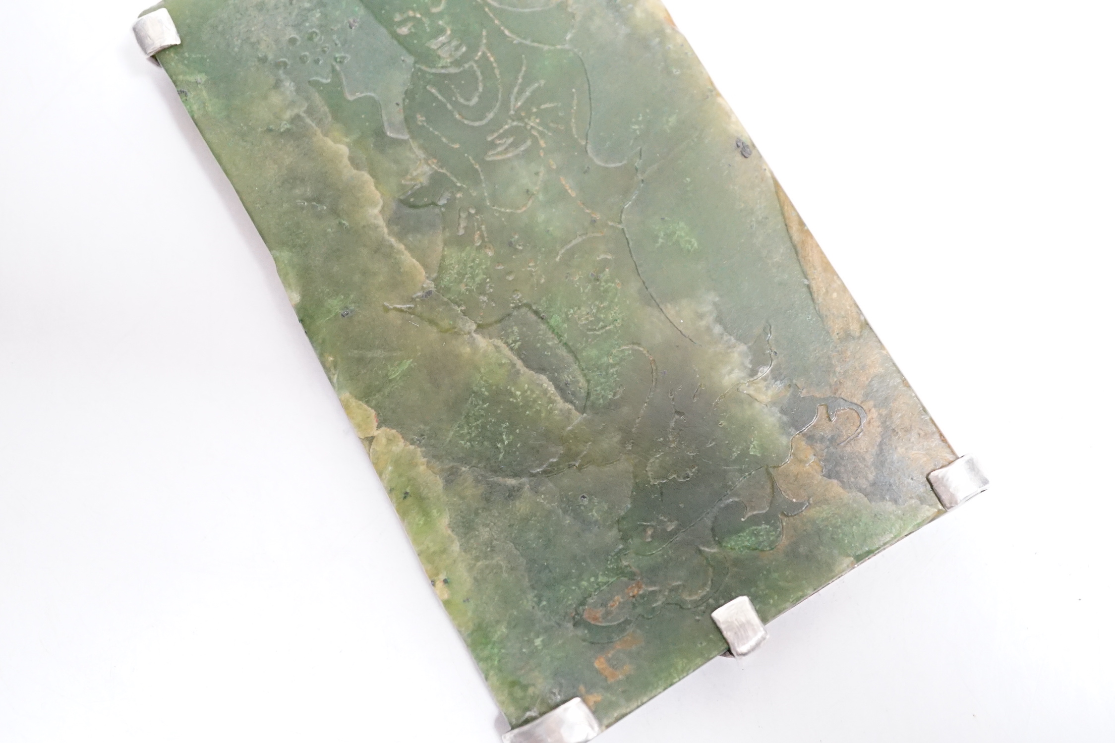 A Chinese carved spinach green jade panel, 9cms high.